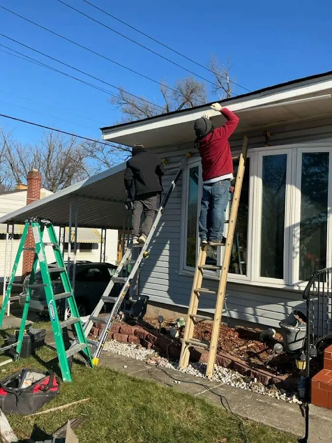 Restoration crew performing exterior repair in Lumberton